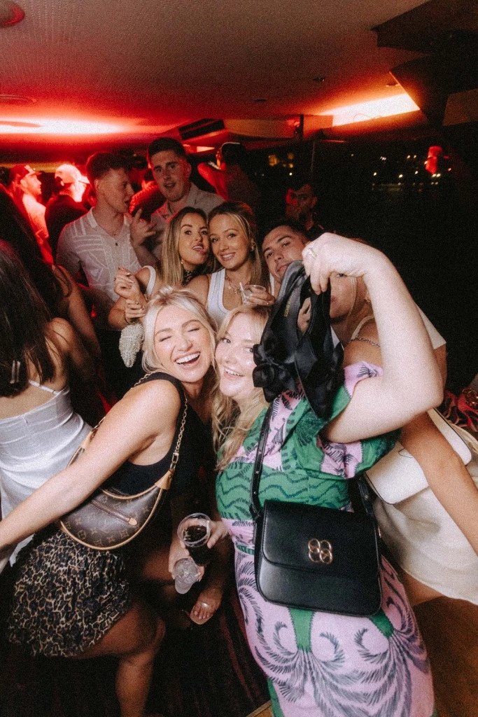 Group of friends celebrating at a Throw Back party