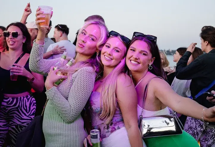 Throw Back event at dusk with crowd and red lights